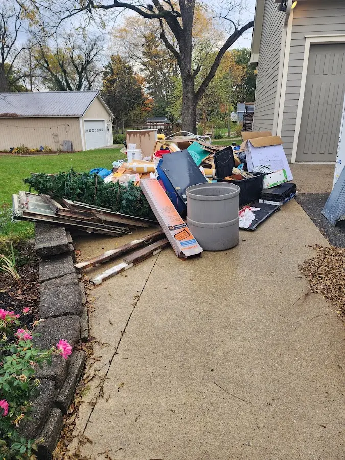 Dumpster being loaded with debris for 12 Yard Dumpster Rental in Sanibel